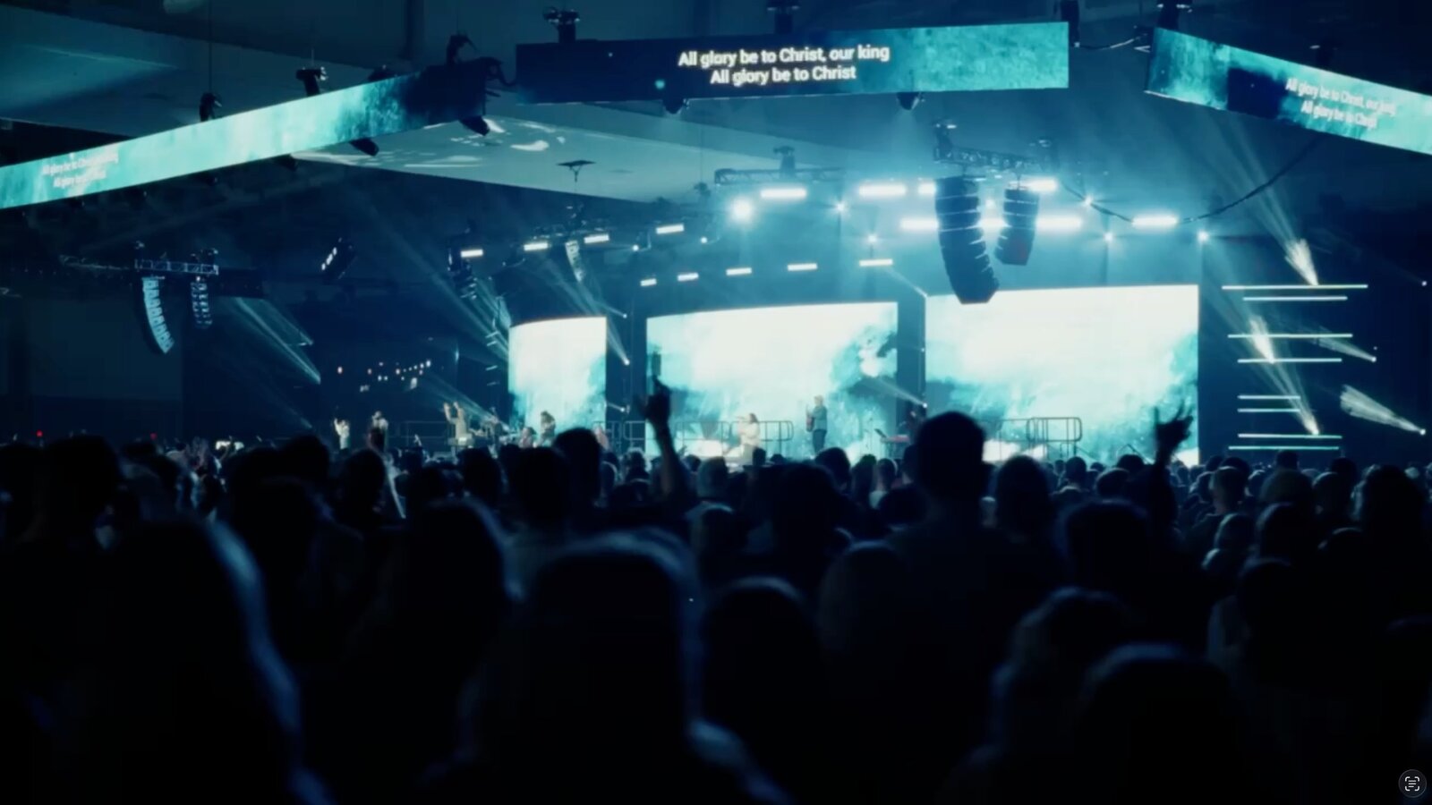 Wide shot of live event with full stage production