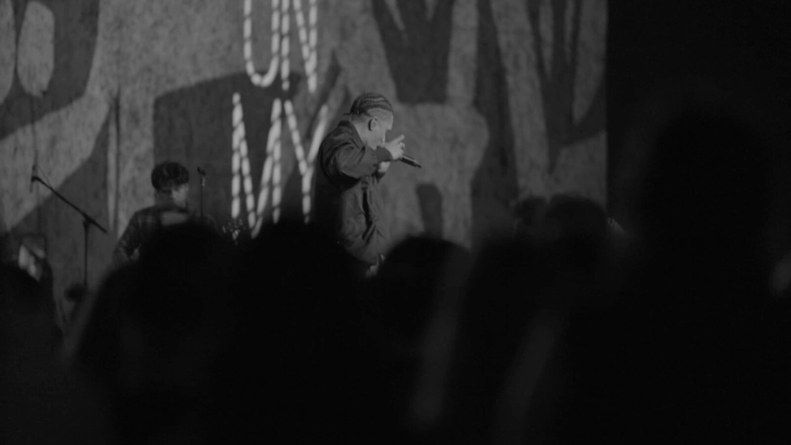 Artist performing in black and white
